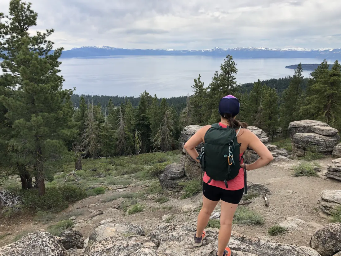 Ashley trail running through a mountain forest